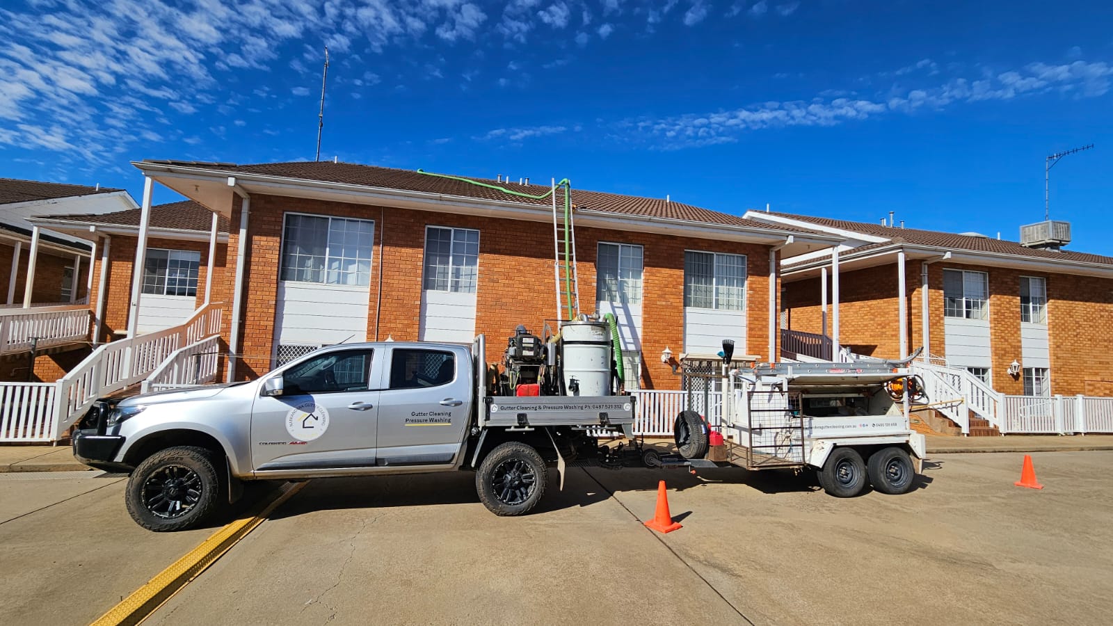 Let It Flow professional gutter vacuum truck and trailer setup at Riverina brick apartments